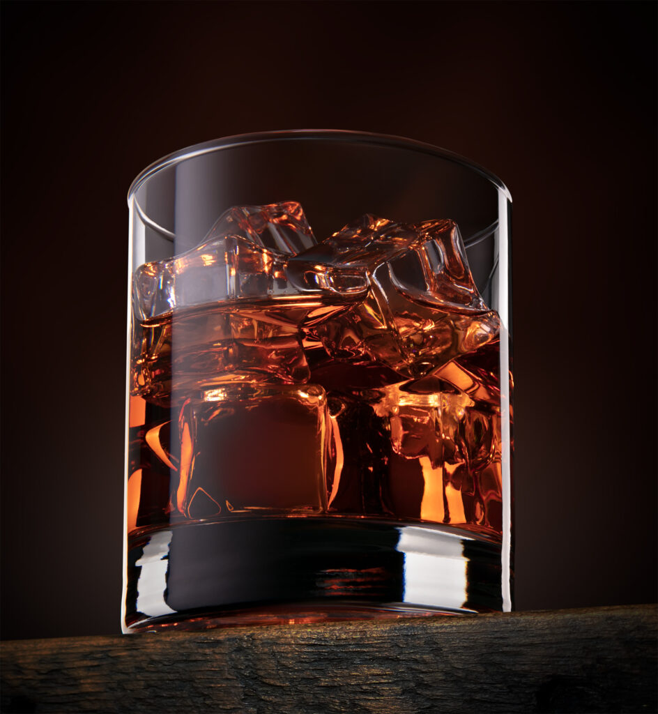 Whisky with ice, in glass. Photography by JL Photographic