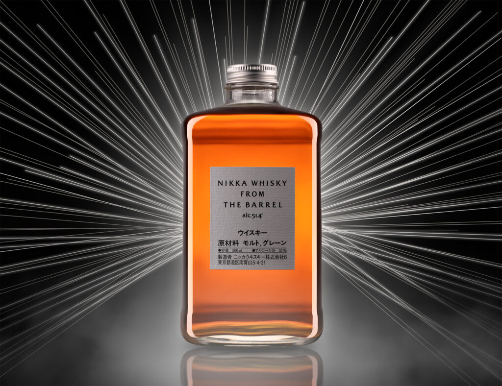 Whisky bottle with creative lighting, by JL Photographic.
